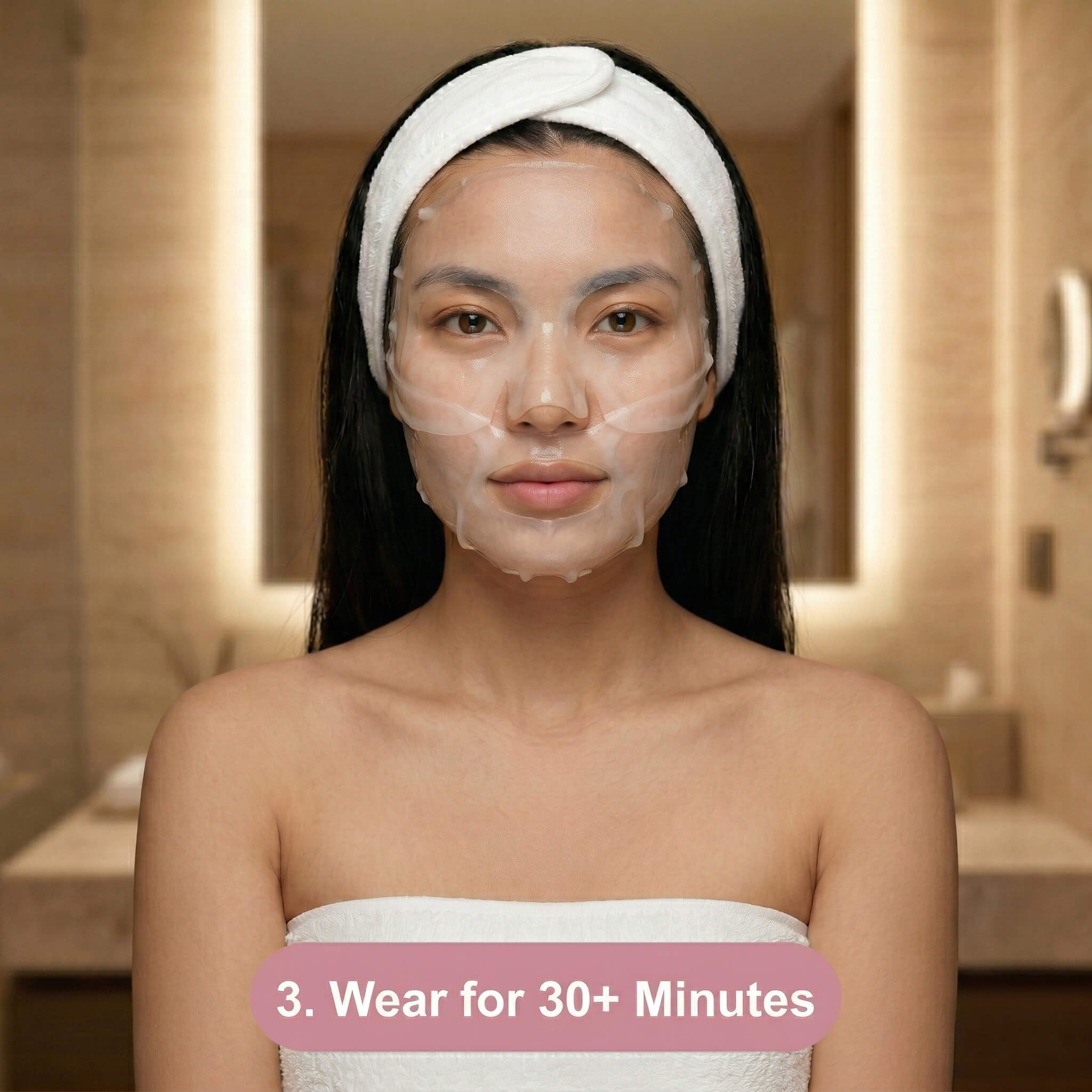 A woman wearing a white headband and a sheet mask sits in a bathroom. Text at the bottom says, 3. Wear for 30+ Minutes.
