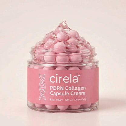A clear jar labeled "PDRN Collagen Capsule Cream" from Cirela Beauty displays pink capsules topped with a swirl of cream, set against a light pink background and promising deeply hydrated skin.