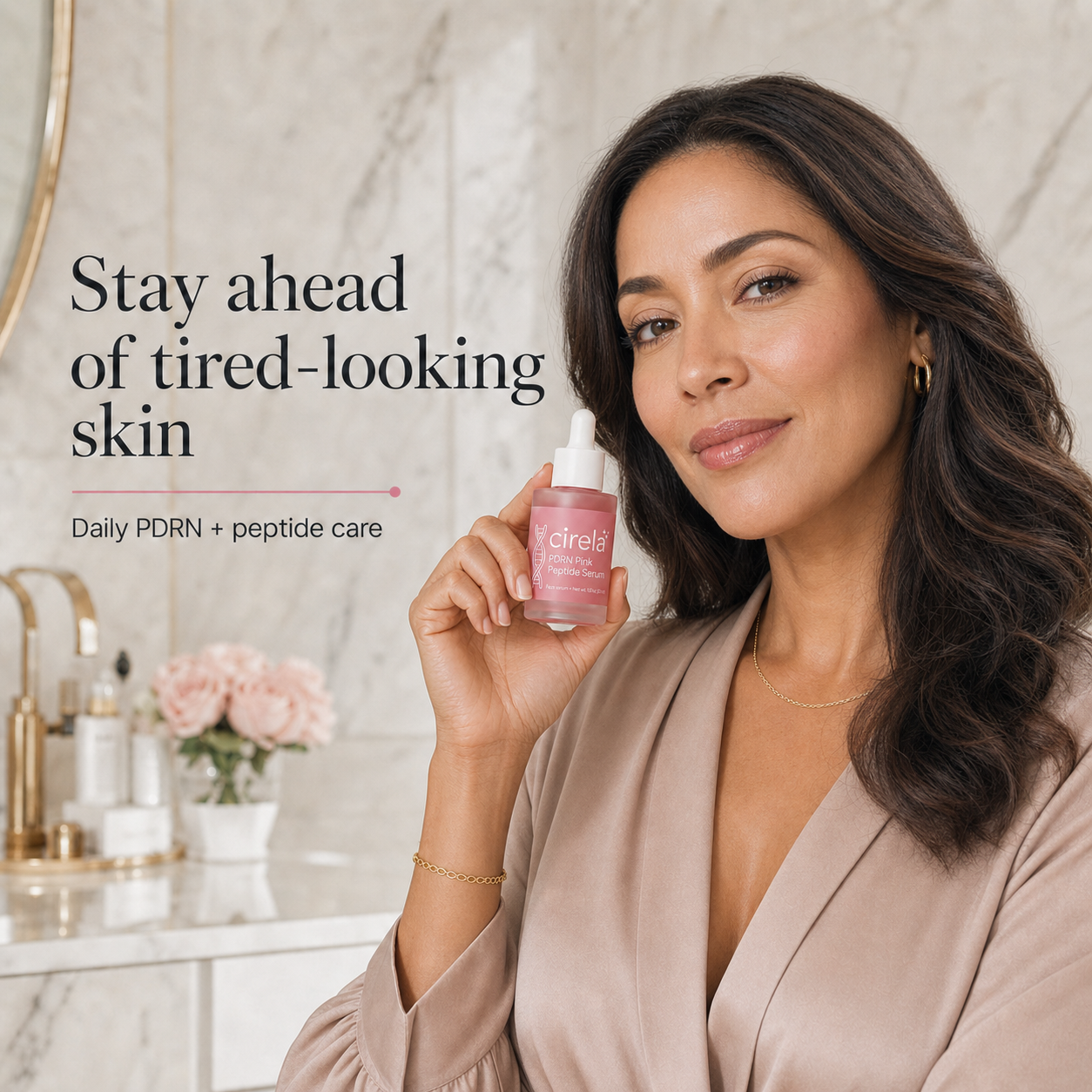 A woman with long brown hair in a beige robe smiles while holding a pink bottle of skincare serum in a bright bathroom. Text on the image reads, Stay ahead of tired-looking skin. Daily PDRN + peptide care.