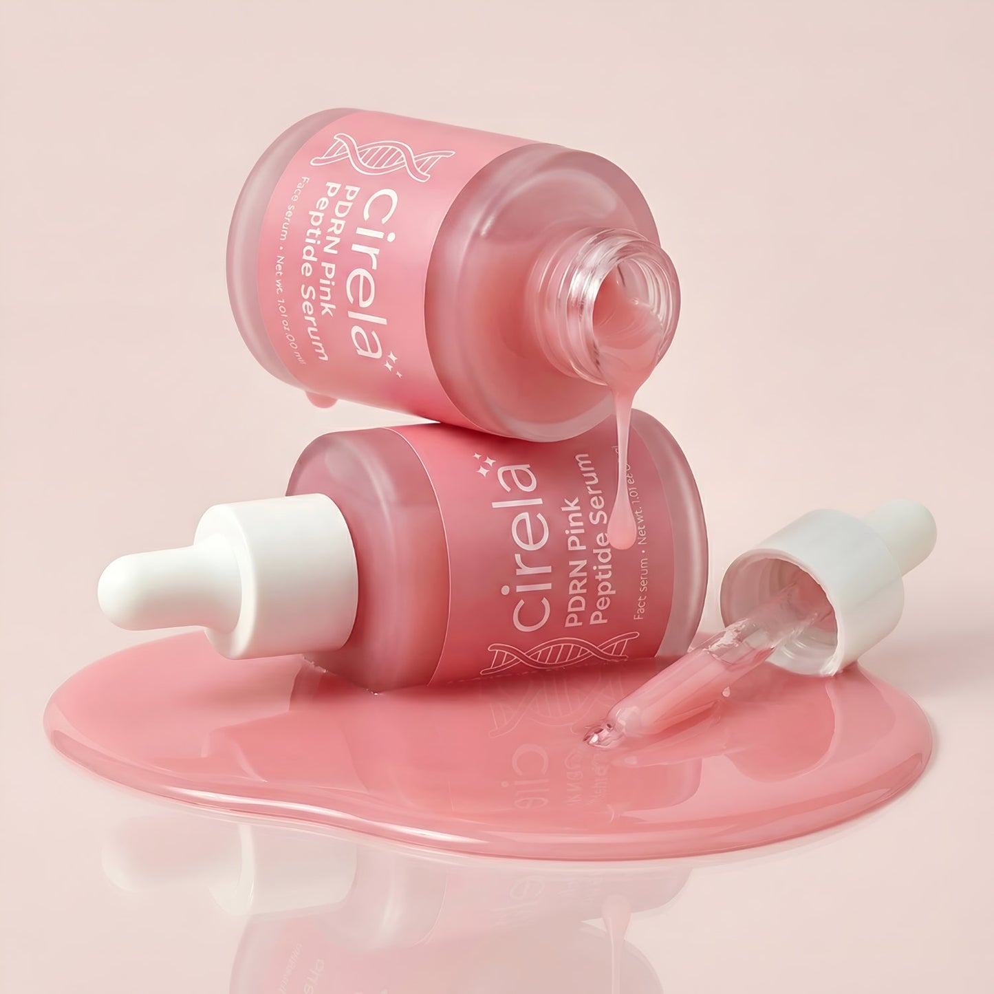 Two pink glass bottles of Cirela Beauty's PDRN Pink Peptide Serum—one upright, one tipped over spilling serum on a glossy surface—with a dropper containing the lightweight hydrating formula nearby.