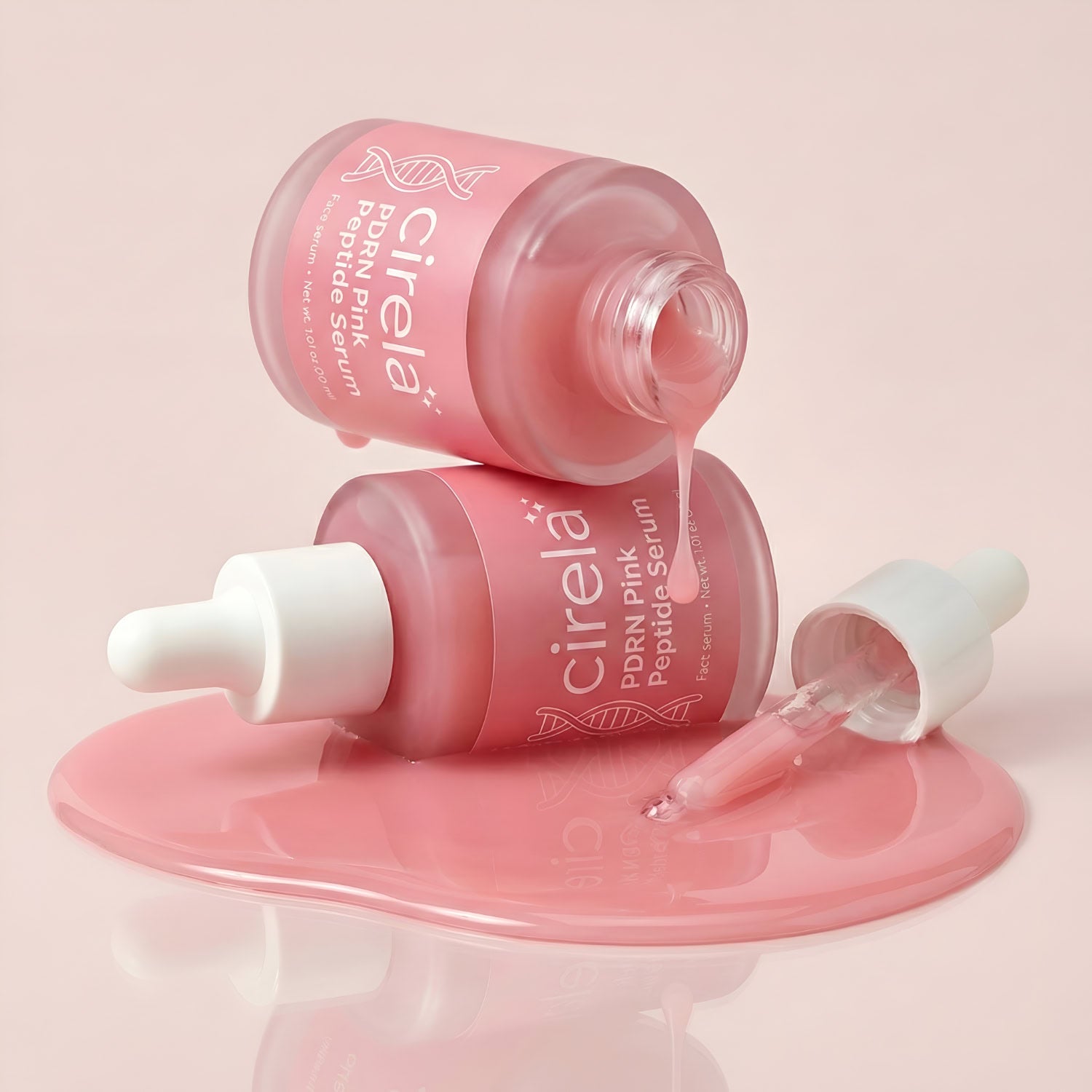 Two pink glass bottles of Cirela Beauty's PDRN Pink Peptide Serum—one upright, one tipped over spilling serum on a glossy surface—with a dropper containing the lightweight hydrating formula nearby.